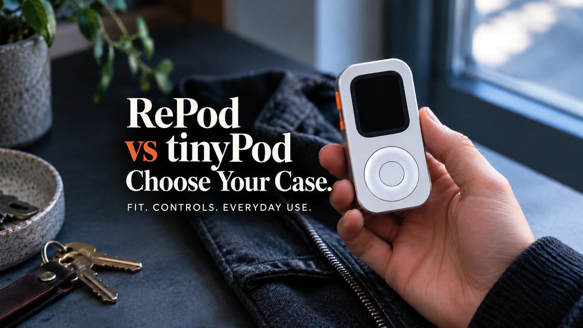 Hand holding a front-facing silver Techpod RePod beside keys and a dark shirt, with the words RePod vs tinyPod: Choose Your Case.