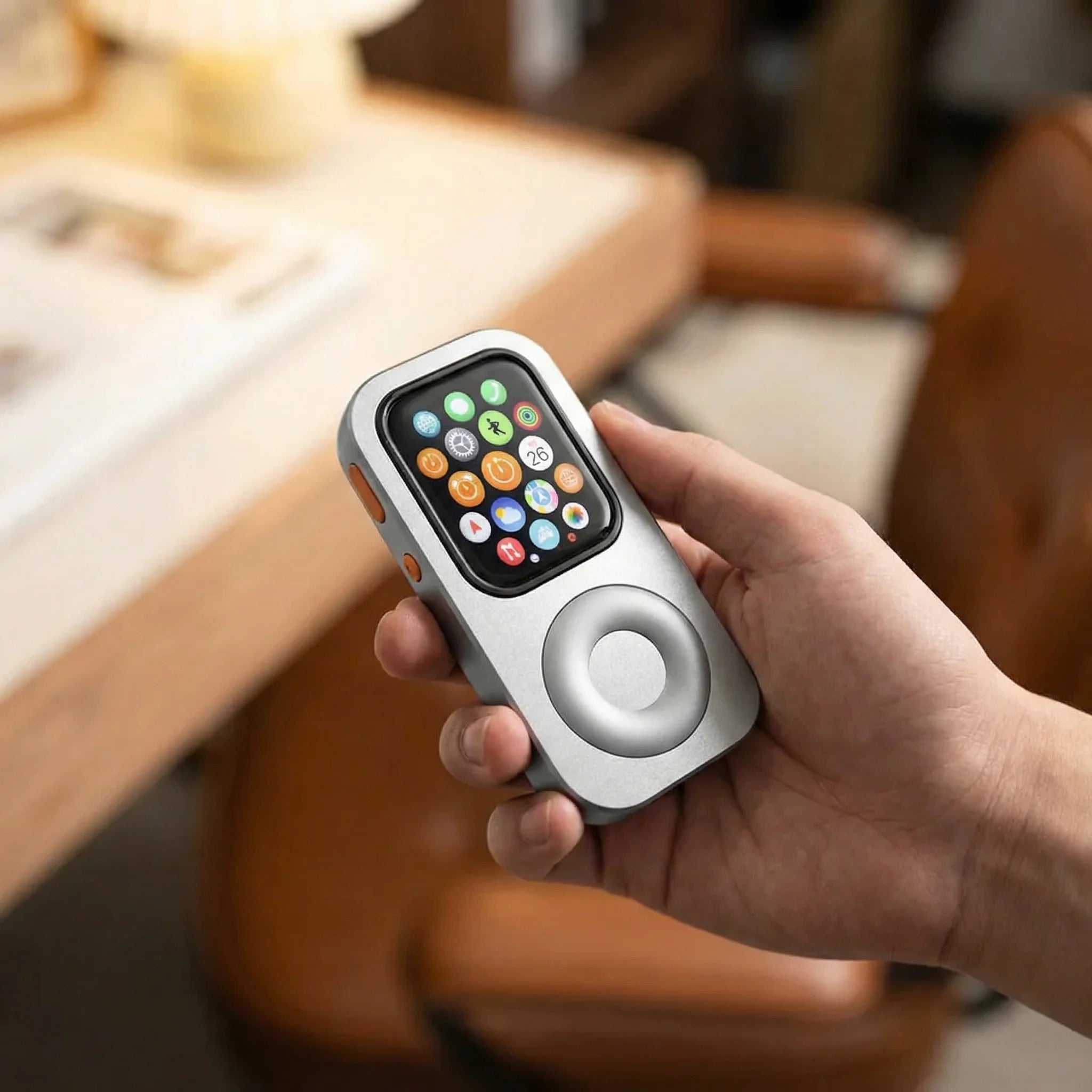 A compatible previous Apple Watch installed in a silver RePod held in one hand